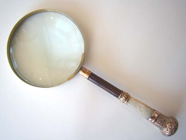 An antique Magnifying Glass with a Mother-of-pearl and gilt brass handle circa 1890